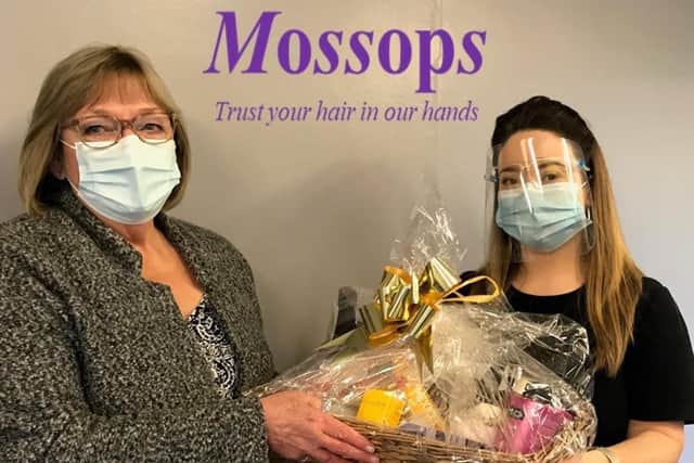 Ann Callaghan presents the hamper to Liz Langdon