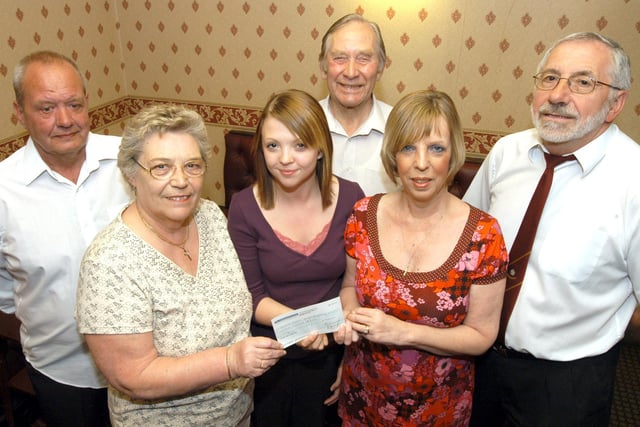 Barbara Sumner, second left and Lynne Hutchinson, second right, trustee of Clipstone Social Club, present a cheque for £500 to Emma Dallman at the club. Also pictured from the left are Fred Newbold, Reg Berrisford and Reg Kerry, steward. 2007.