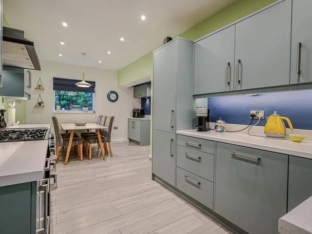 The large breakfast kitchen is a highlight, with integrated fridge freezer, dishwasher and a useful utility cupboard.