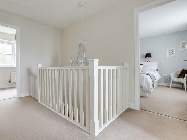On arriving upstairs, you are greeted by this landing, which has a carpeted floor, an airing cupboard and two hatches that give access to the Owston Road property's loft.