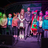 Christmas light switch on at Sutton Market Place. Chairman Coun Dale Grounds with helpers for the switch on.