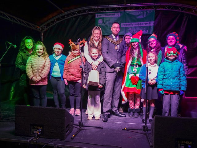 Christmas light switch on at Sutton Market Place. Chairman Coun Dale Grounds with helpers for the switch on.
