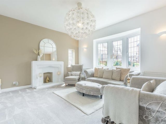 The first room to catch the eye on the ground floor of the West Hill Avenue house is this brilliant living room. It is distinguished by a large bay window facing the front of the property, and a feature fireplace.