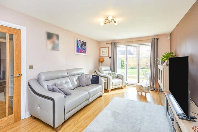 Setting the tone for the rest of the property is the lounge. It is a lovely, spacious room with uPVC double-glazed, tri-folding doors that lead out to the back garden. A further uPVC double-glazed window to the front of the house adds to the brightness, while the floor is laminated..