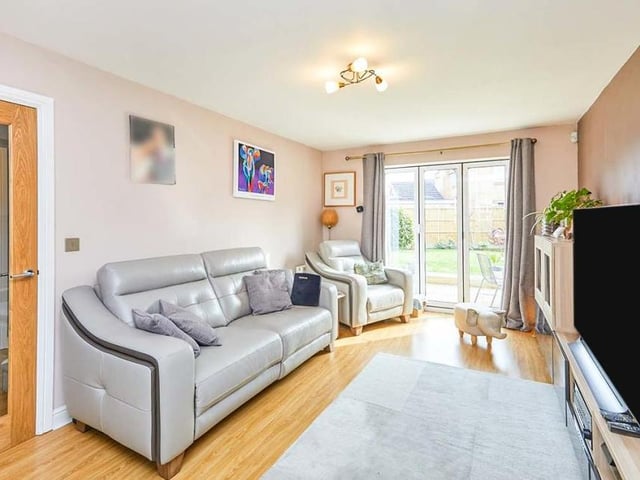 Setting the tone for the rest of the property is the lounge. It is a lovely, spacious room with uPVC double-glazed, tri-folding doors that lead out to the back garden. A further uPVC double-glazed window to the front of the house adds to the brightness, while the floor is laminated..
