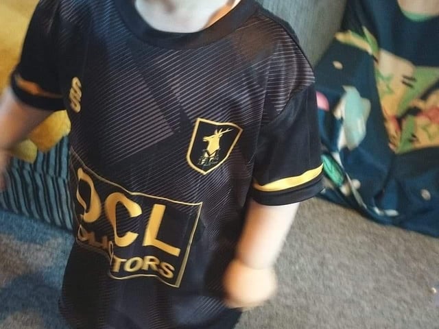 The next generation cheers on the boys.