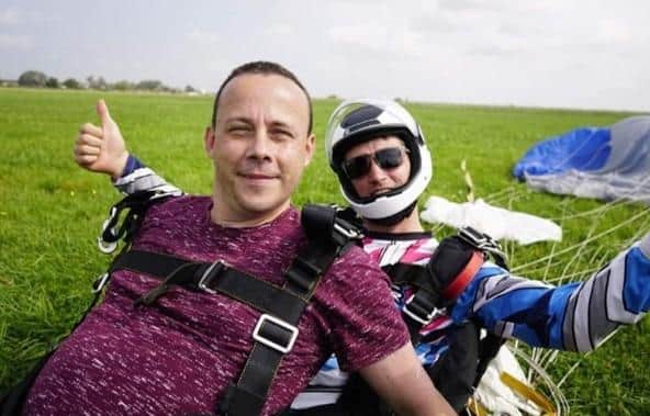 Pete Colclough, 41, has completed a skydive in memory of his partner Dave Holtham who died after suffering with a chronic lung condition.