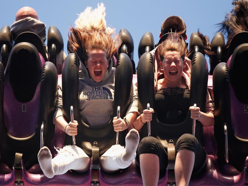 Revellers enjoy a hair-raising ride at the fair in 2010.