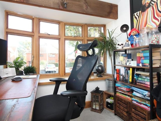 The second reception room at the house is currently being used as a study. An attractive space, it faces the front of the property, via a solid wood, double-glazed bay window, and also boasts exposed ceiling beams.