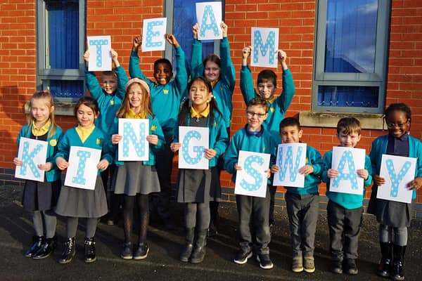 Pupils at Kirkby's Kingsway Primary School celebrate their good Ofsted report.