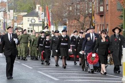 2007: Uniformed personnel parade through streets in solemn Remembrance Day tribute.