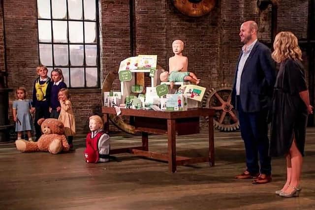 Matt and Kate Ball pitching on Dragons’ Den with four of their children.