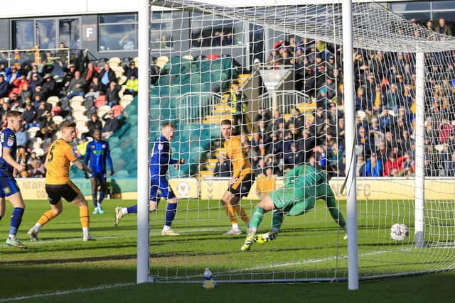 George Maris nets the winner during the Sky Bet League 2 match against Newport County AFC at Rodney Parade 02 March 2024.Photo credit : Chris & Jeanette Holloway / The Bigger Picture.media