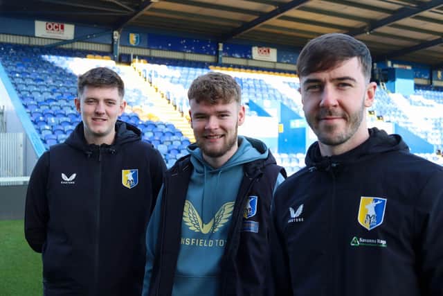 Mansfield Town Community Trust staff members Alex Cartwright (left), Bradley Giles and Mitchell Scotford (right) are taking on a 77km walk from Huddersfield to Mansfield. Photo: Submitted