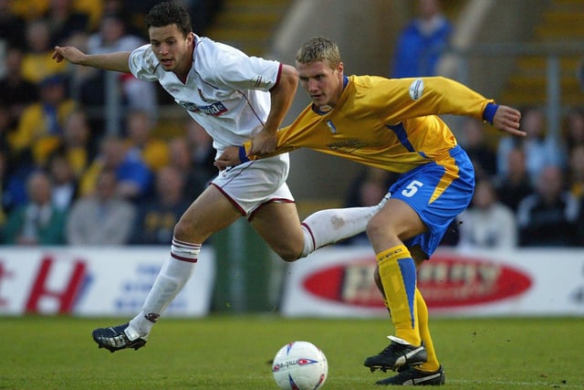 Mark Richards is challenged by Rhys Day during the Nationwide Division Three Play Off Semi Final, Second Leg between Mansfield Town and Northampton Town at Field Mill on May 20, 2004.