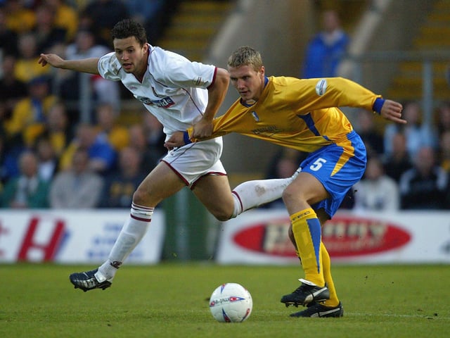 Mark Richards is challenged by Rhys Day during the Nationwide Division Three Play Off Semi Final, Second Leg between Mansfield Town and Northampton Town at Field Mill on May 20, 2004.