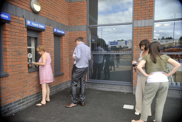 Fans buying tickets to see games at the new ground.