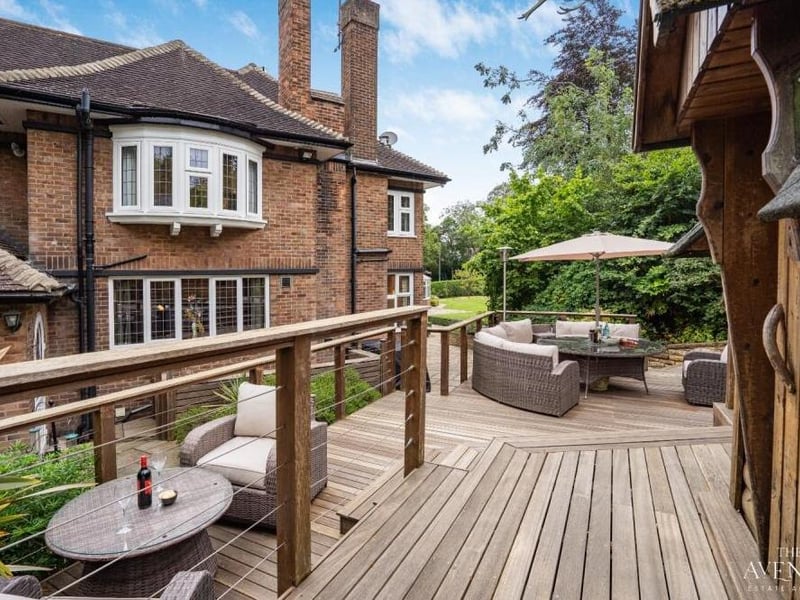 As well as a lawn, trees, shrubs and plants in the back garden, you will find this raised decking area, which is ideal for al fresco dining or for entertaining friends.
