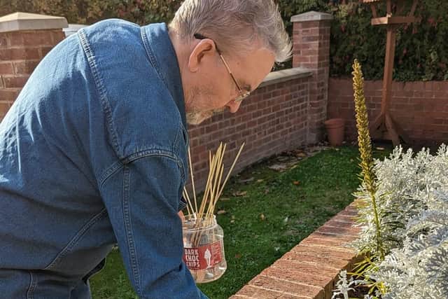 Joe O’Brien putting the finishing touches to a special spot of remembrance in the garden at Alexandra House Care Home.