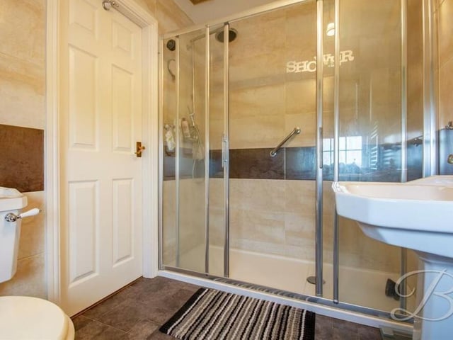 This is a close-up of the walk-in shower enclosure in the en suite to the master bedroom.