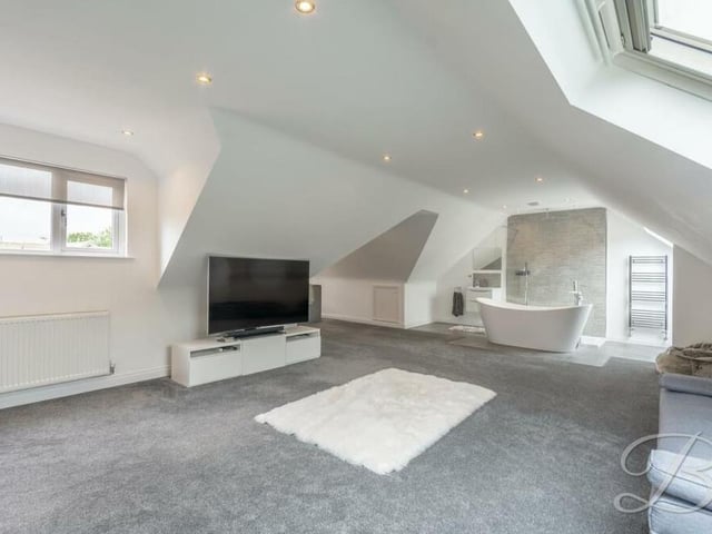 Forgive us if we spend a bit of time in the master bedroom on the first floor because it is a remarkable space. It features fitted carpets, two windows to the side of the bungalow, a Velux window and downlights.