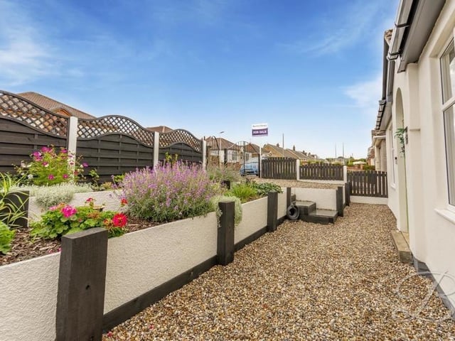 Our last look at the Budby Avenue bungalow shows the gate and path that leads to the front door? Will you be knocking on that door soon for a viewing?