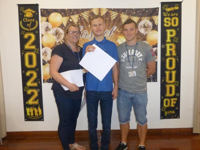 Bradley McKnight, centre, is pictured with Shelley Cantillon, physical and sensory co-ordinator and Jordan Mitchell, learning progress assistant