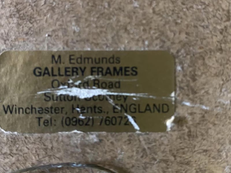 A sticker on the back of one of the frames