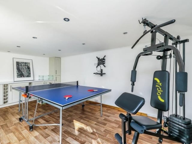 Here's what the inside of the log cabin looks like at the moment as it functions as a games room and mini-gym. But its versatility knows no bounds.