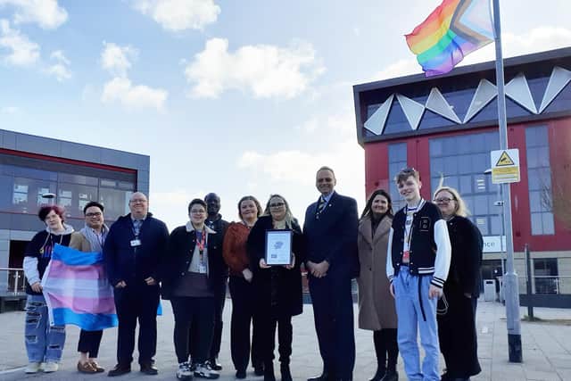 Andrew Cropley, fourth from right, West Nottinghamshire College principal and chief executive, accepts the Rainbow Flag award.