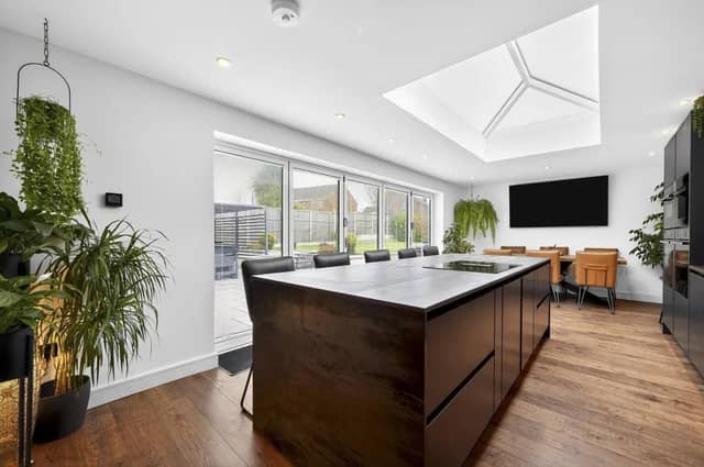 The impressive kitchen/dining room forms the heart of the home