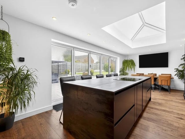 The impressive kitchen/dining room forms the heart of the home