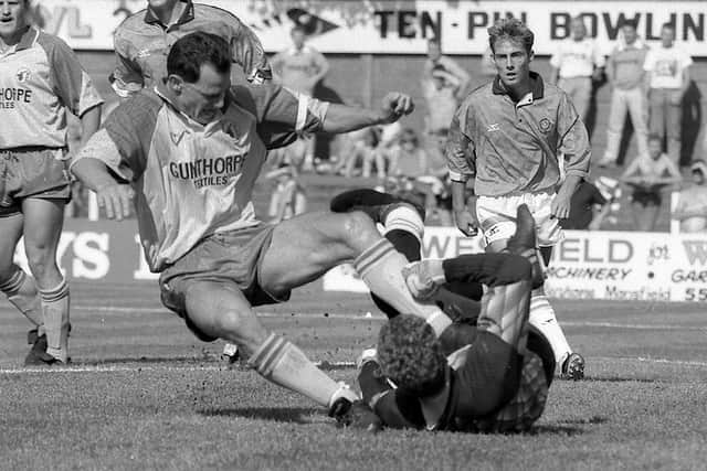 Steve Charles getting stuck in for Stags against Blackpool in 1991.