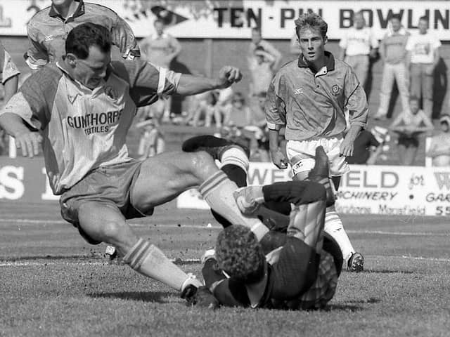 Steve Charles getting stuck in for Stags against Blackpool in 1991.