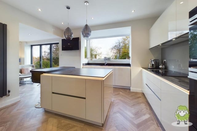 Next door to the lounge is a cracking kitchen that combines style with functionality and boasts modern gloss units.