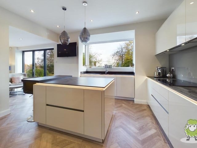 Next door to the lounge is a cracking kitchen that combines style with functionality and boasts modern gloss units.