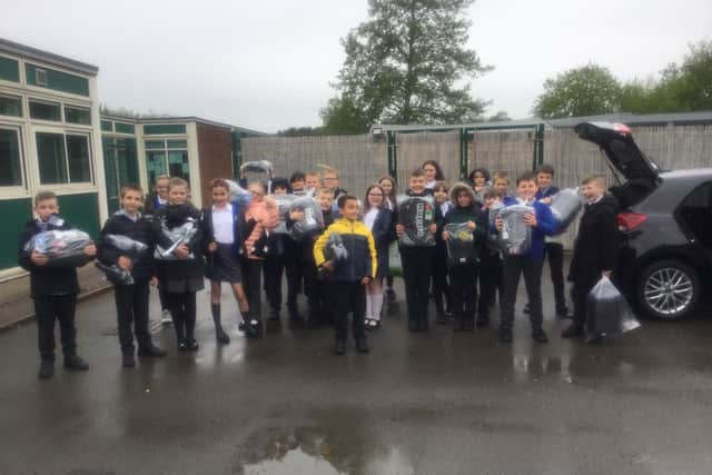 Children from Rainworth's Lake View School pictured with the sleeping bags, clothing and toiletries they bought for The Beacon Project in Mansfield.