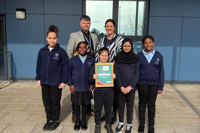 Bluecoat Primary Headteacher Ben Jackson(L) and Safeguarding Lead Kathryn Brown (R) with several young carers