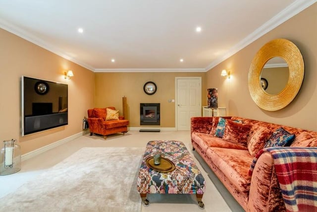 Next stop is the spacious lounge,which includes a modern wall-mounted fireplace with inset gas fire and granite hearth beneath. A comfortable, relaxing space, it has six ceiling spotlights and three wall-light points.