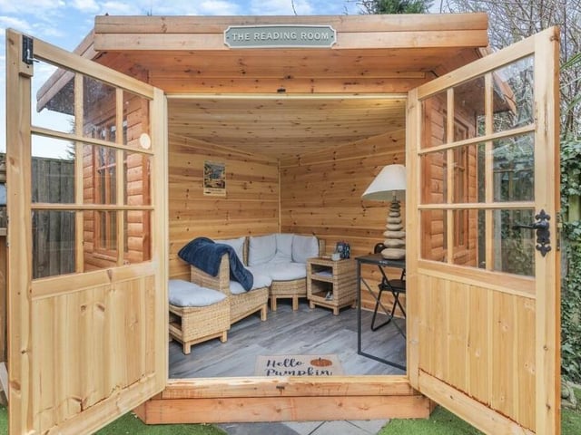 The garden's summer house is an enchanting retreat. It is equipped with power and lighting, and boasts underfloor heating too.