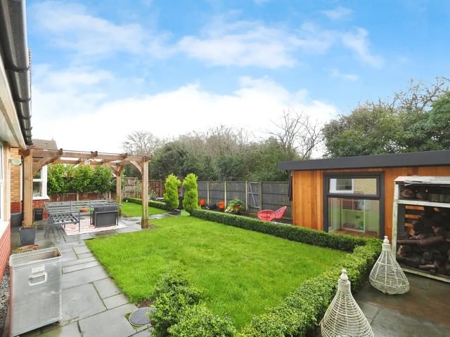 Outside, the home continues to impress with a family-friendly garden that offers space for children to play, summer entertaining and outdoor living.