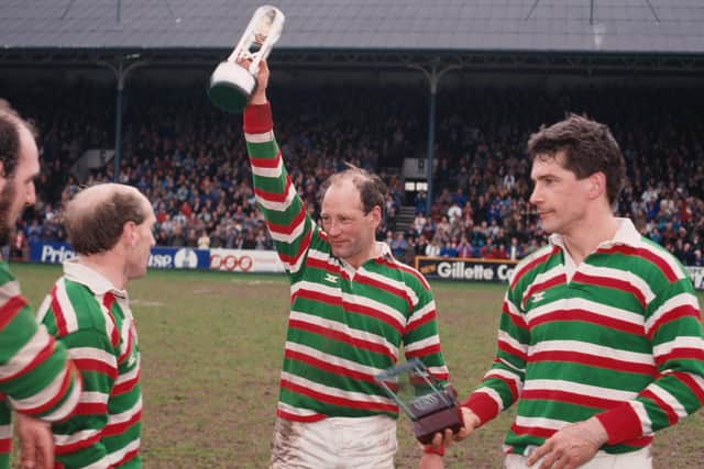 Dusty Hare (centre) of Leicester Tigers, lifts the trophy after his team's 39-15 win against Waterloo R.F.C. won them the Courage League National Division One title at Welford Road Stadium in 1988. (Photo by Russell Cheyne/Getty Images)