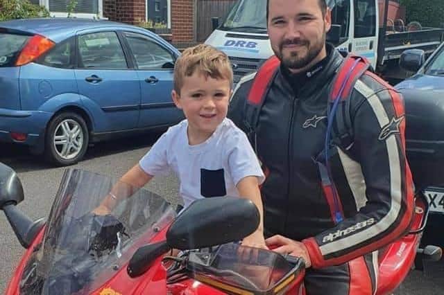 Ben Gillway on his dad's bike, with his four-year-old son Joey.