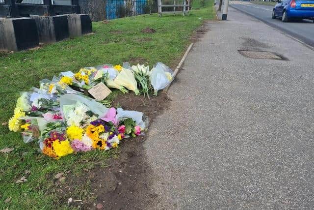 MARCH - floral tributes are left at the roadside after the death of Mansfield teacher Sarah Bland, who was killed in an accident while riding her bicycle.