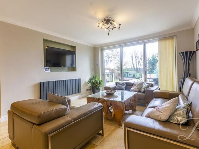 This is the lovely lounge that is part of the open-plan kitchen. The French doors lead outside to the garden.