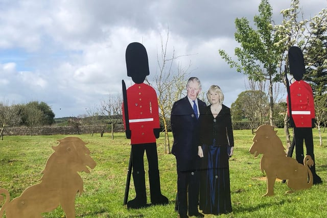 King Charles III and Queen Camilla take a stroll around Warsop Carrs ahead of the King's coronation on Saturday, May 6.