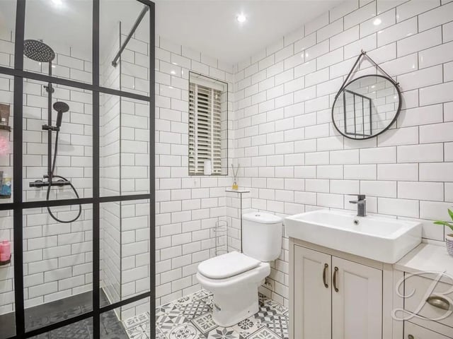 The stylish three piece suite features a walk in shower, low flush WC and hand wash basin.