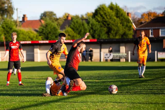 Ollerton come away with the ball.