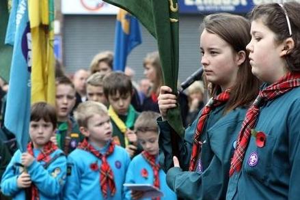 2011: Children pay their respects at the Cadets Cross in Eastwood.