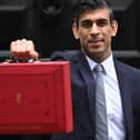 Chancellor Rishi Sunak with his Budget Box ahead of presenting his Autumn Budget and Spending Review to Parliament.